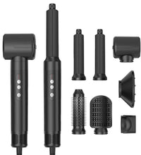 Black hair styling tool with multiple attachments on a white background