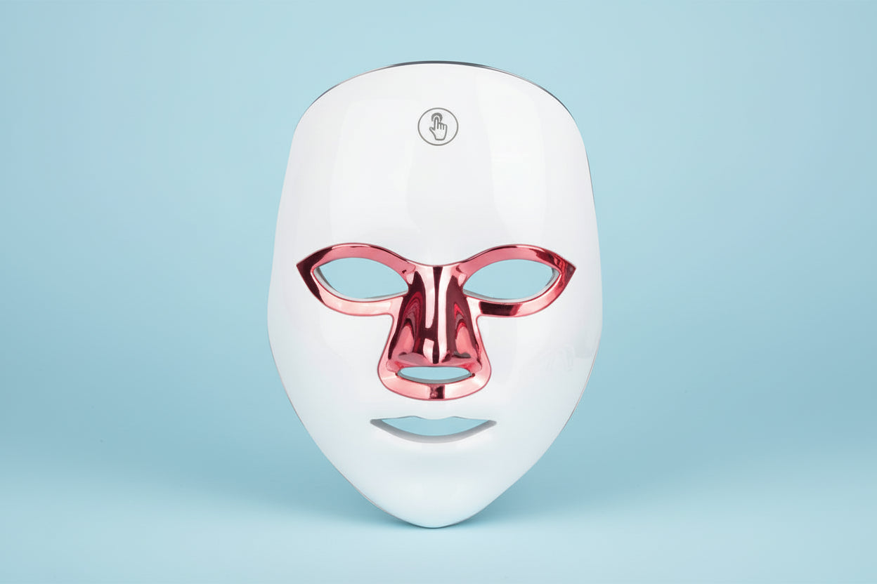 White LED face mask with red accents on a white background