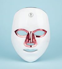 White LED face mask with red accents on a white background