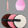 Set of cleaning sponges with a pink facial cleansing brush on a white background