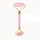 Pink facial roller with gold accents on a white background