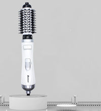 Close-up of the rotating control buttons and power switch on the ergonomic handle.