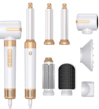 Set of white and gold hair styling tools on a white background