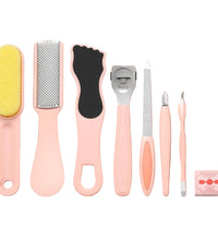 Set of foot care tools on a pink background