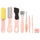 Set of foot care tools on a pink background