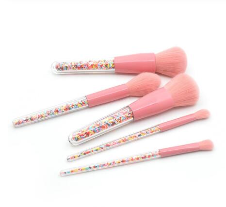 Close-up of pink synthetic makeup brush bristles showing soft texture and uniform shape.