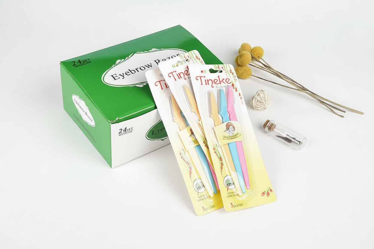Eyebrow parsing tools with packaging on a light blue background
