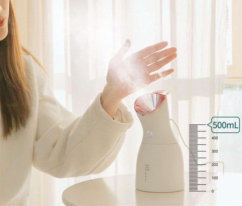 Person using a handheld humidifier with a visible brand logo on a light background