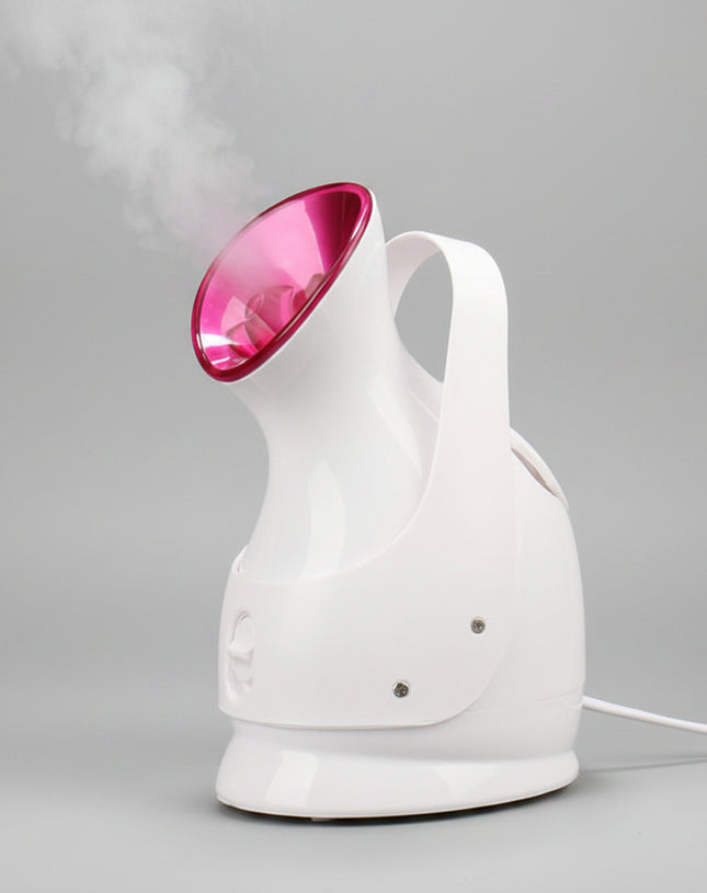 White handheld steamer with pink top emitting steam on a black background